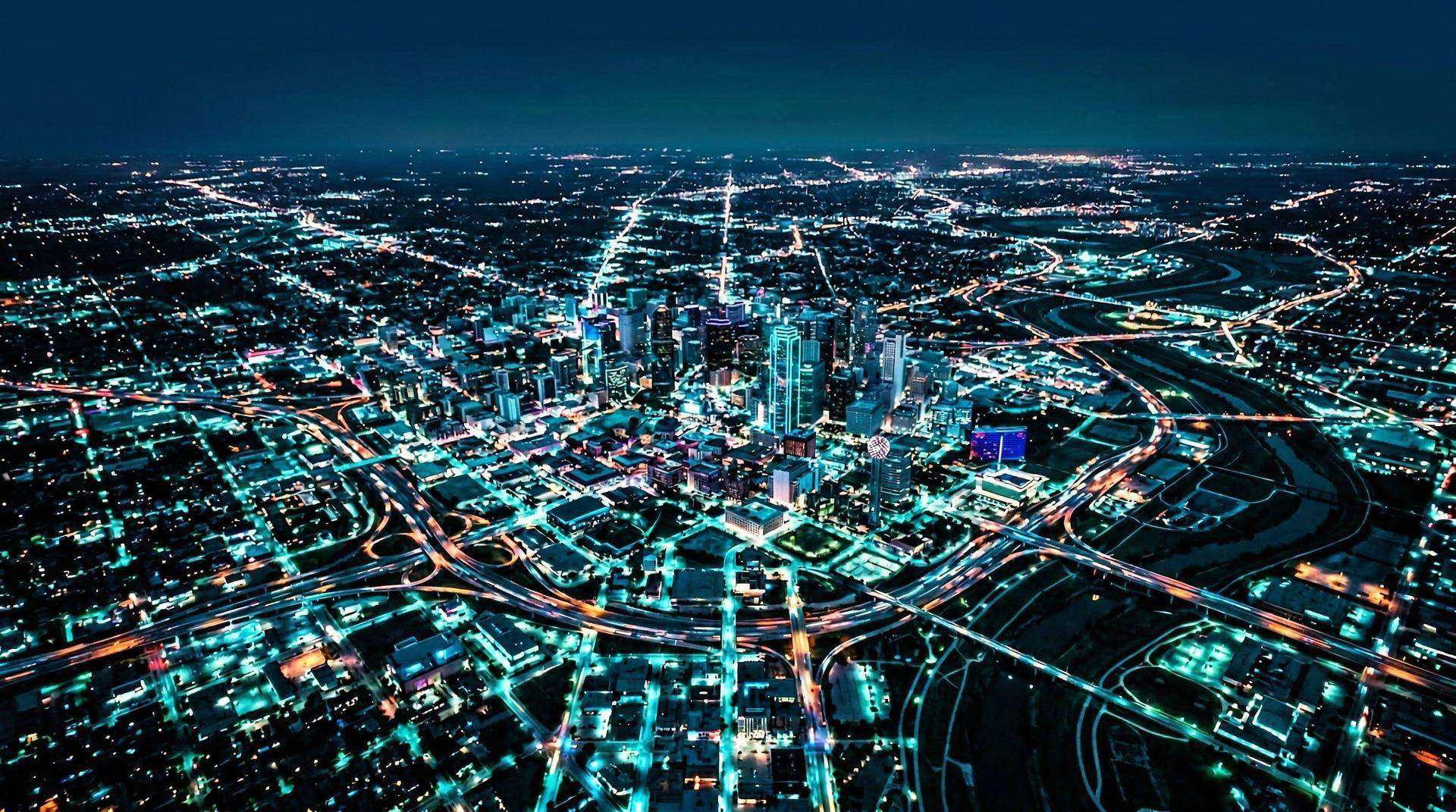 Aerial drone photograph of the Dallas-Fort Worth skyline at dusk, captured by Orcrist Drone Services